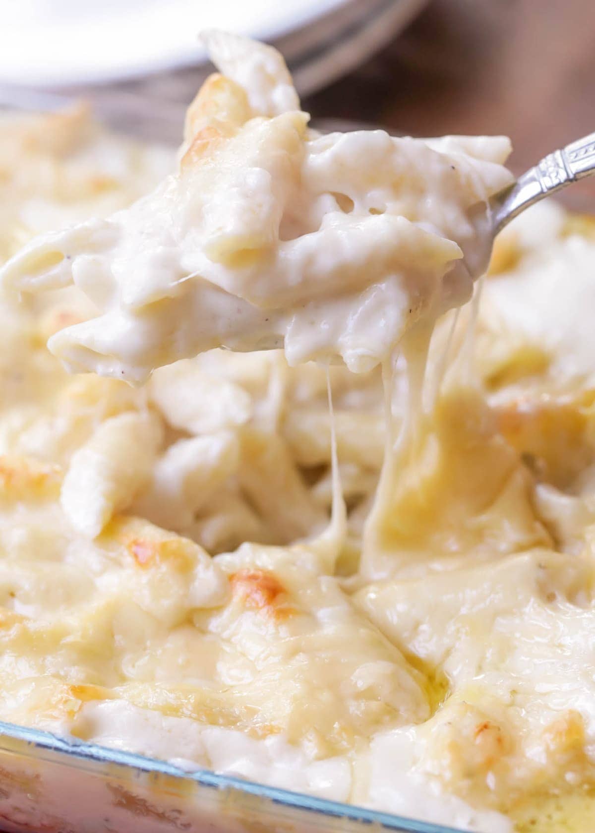 Christmas dinner ideas - close up of a scoop of baked macaroni and cheese.