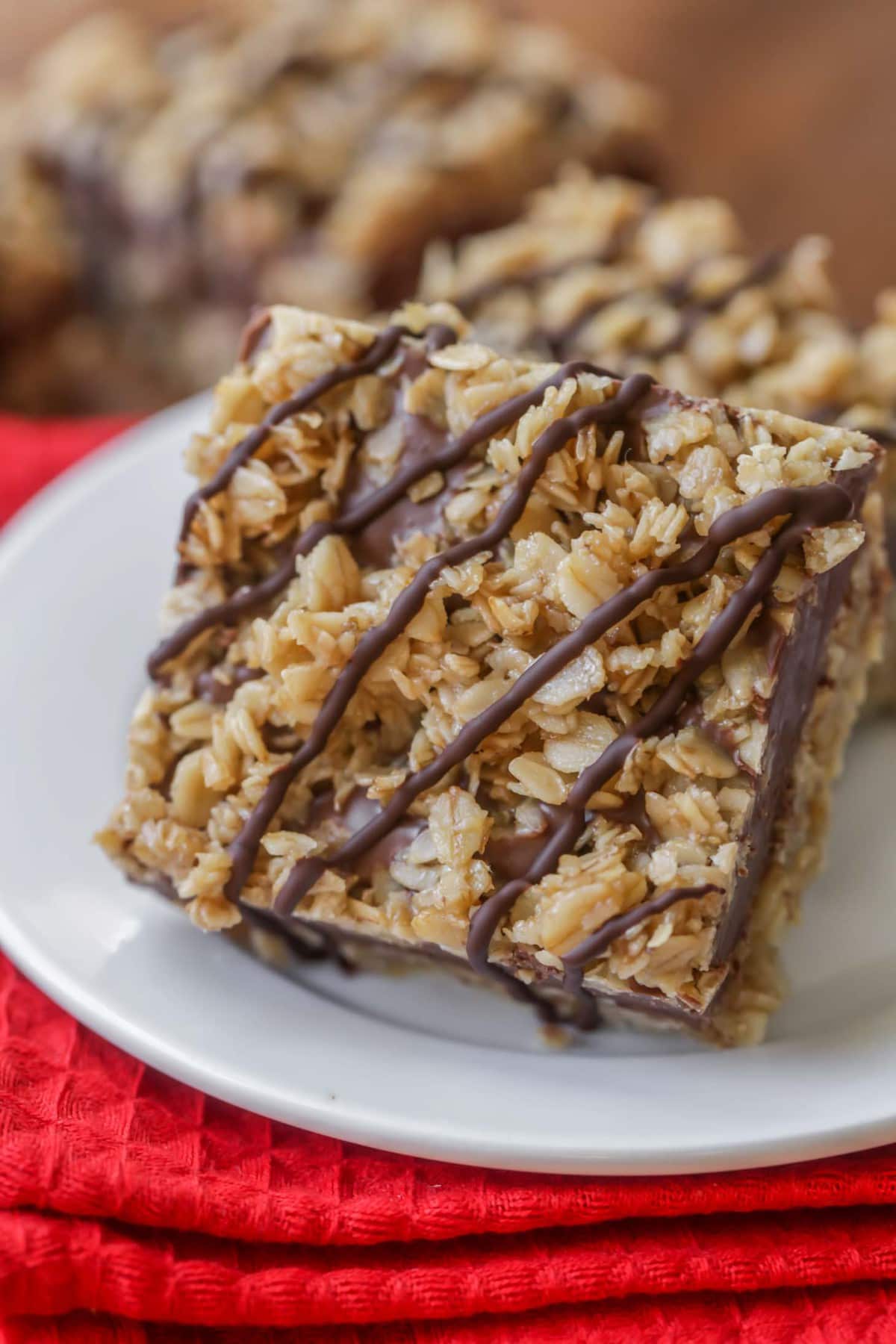  no bake Chocolate Oat Bars stacked on a white plate