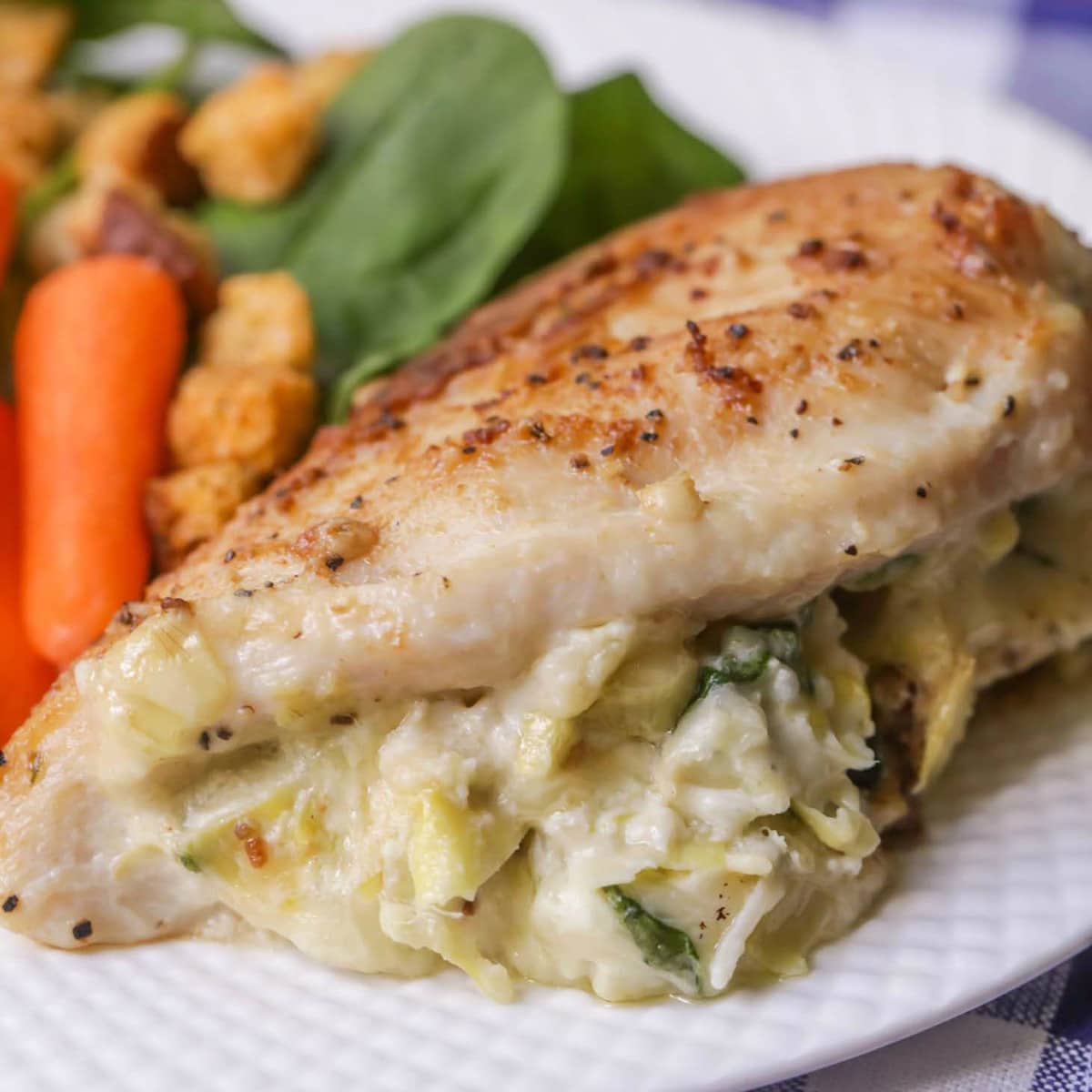 Spinach Artichoke Stuffed Chicken on plate