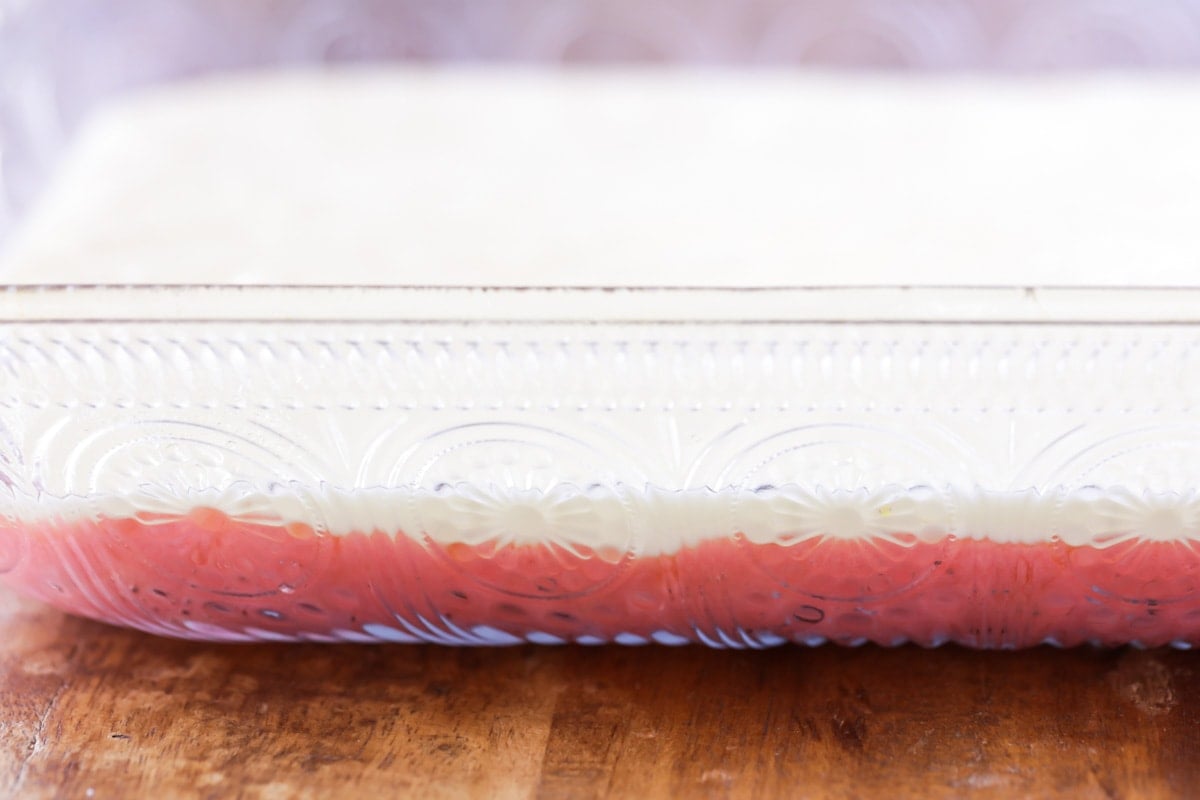 Layered Strawberry Butter Cake in a glass baking dish.