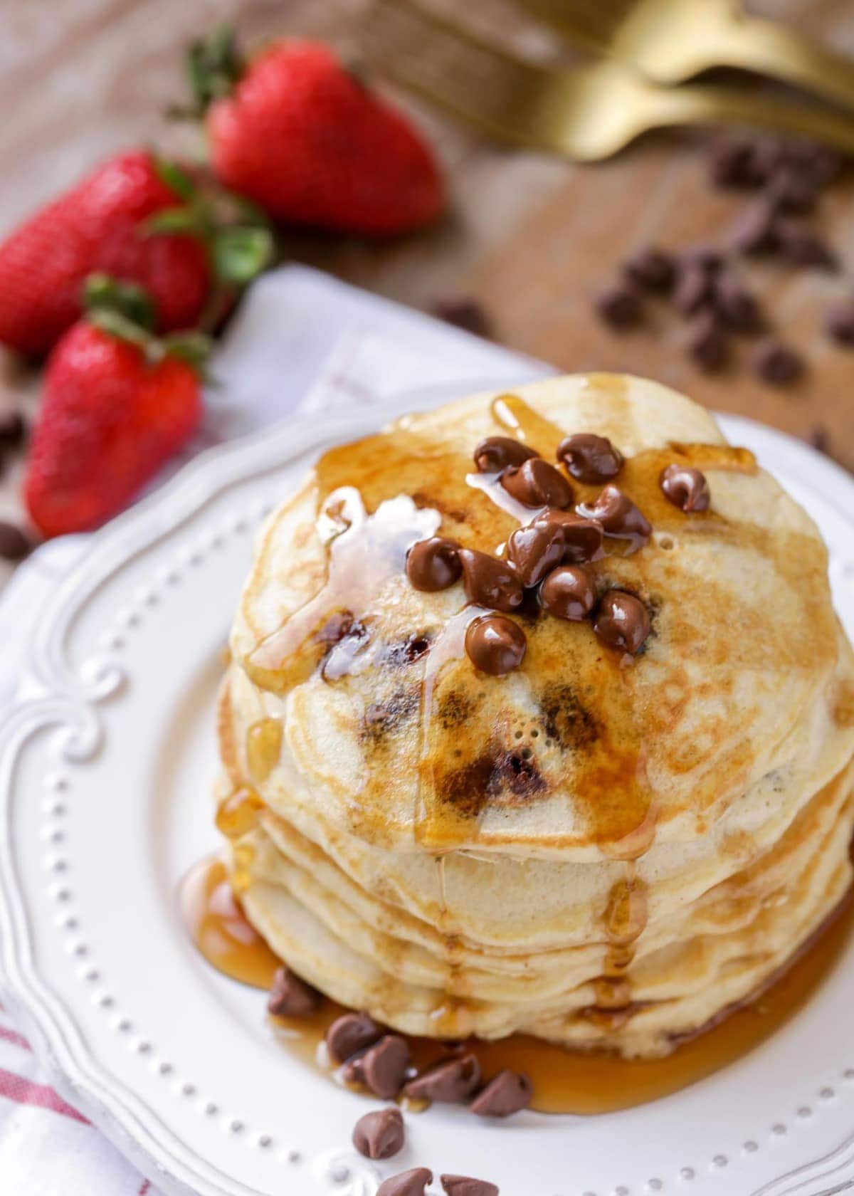Chocolate Chip Pancakes stacked on a white plate