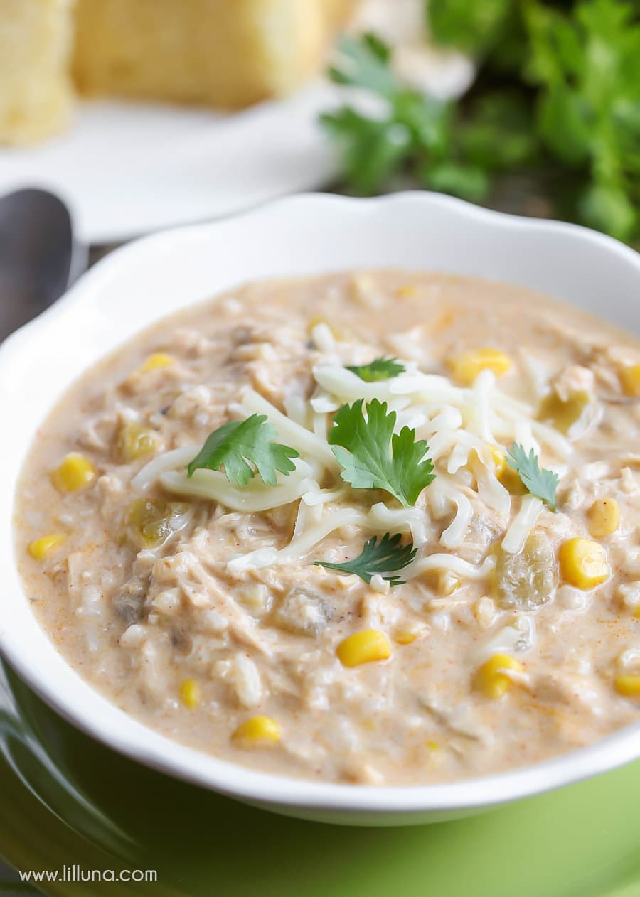 Chicken Enchilada Soup served in a white bowl and topped with cilantro.