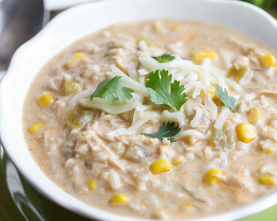 Chicken Enchilada Soup topped with cheese and cilantro.