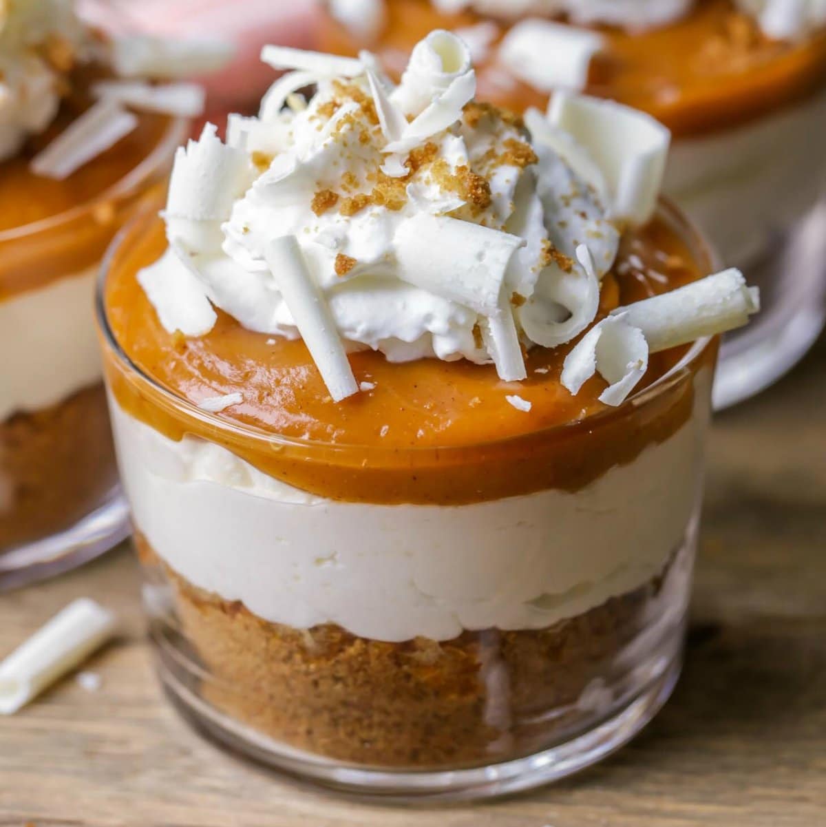 Thanksgiving desserts - a glass cup filled with pumpkin pudding parfaits.
