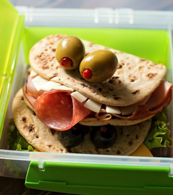 Halloween snacks - flatout monster sandwiches in tupperware.