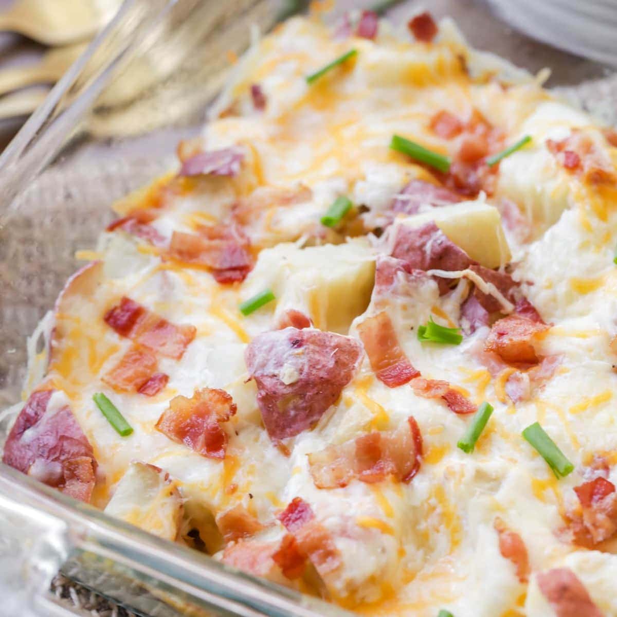 Christmas side dishes - twice baked potato casserole topped with bacon and green onions.