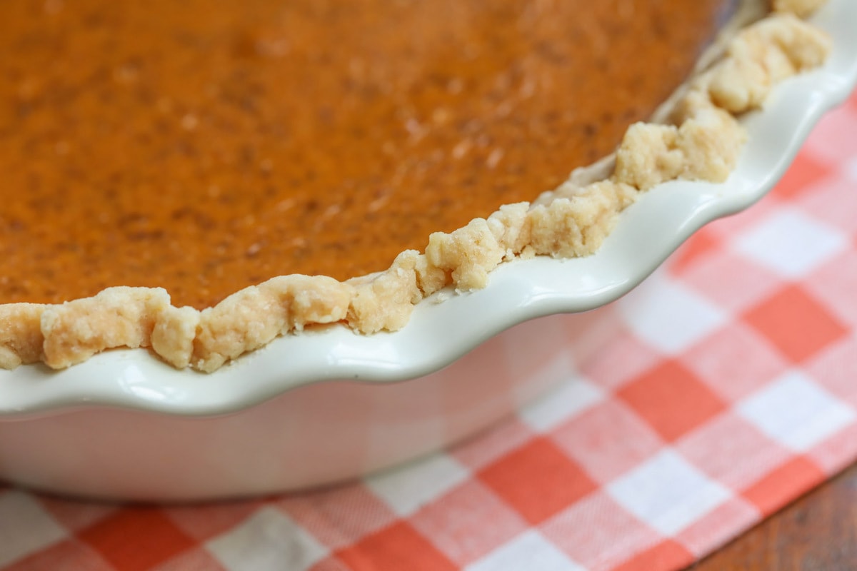 Pumpkin Pie in a white pie pan.