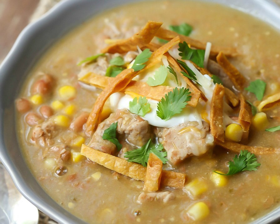 Green enchilada Pork Chili served up in a grey bowl