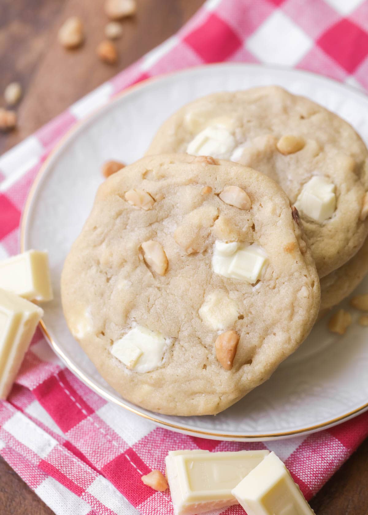 White chocolate chip macadamia nut cookies piled on a plate