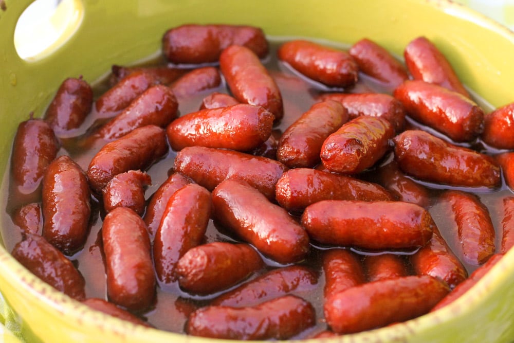 4th of July Appetizers - Brown sugar beanie weenies in a yellow bowl.