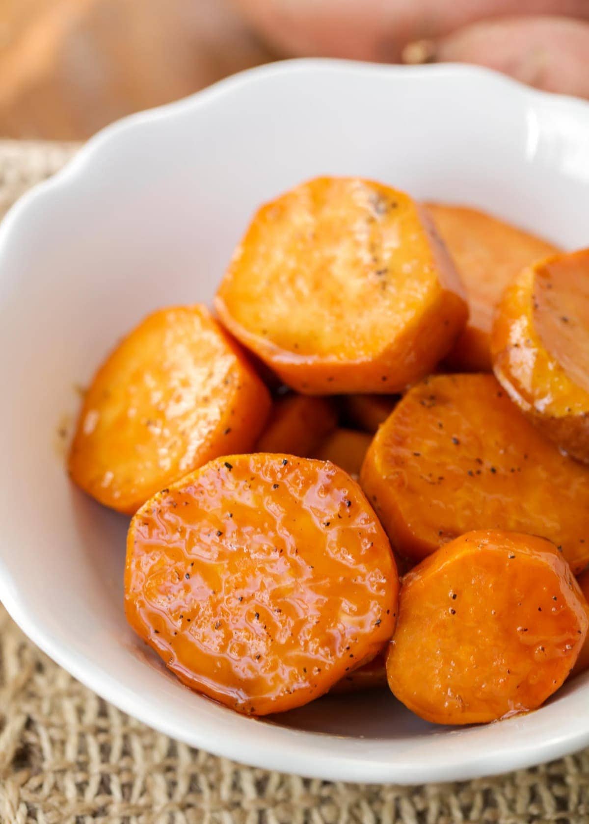 Candied Sweet Potatoes Recipe served in a white bowl.