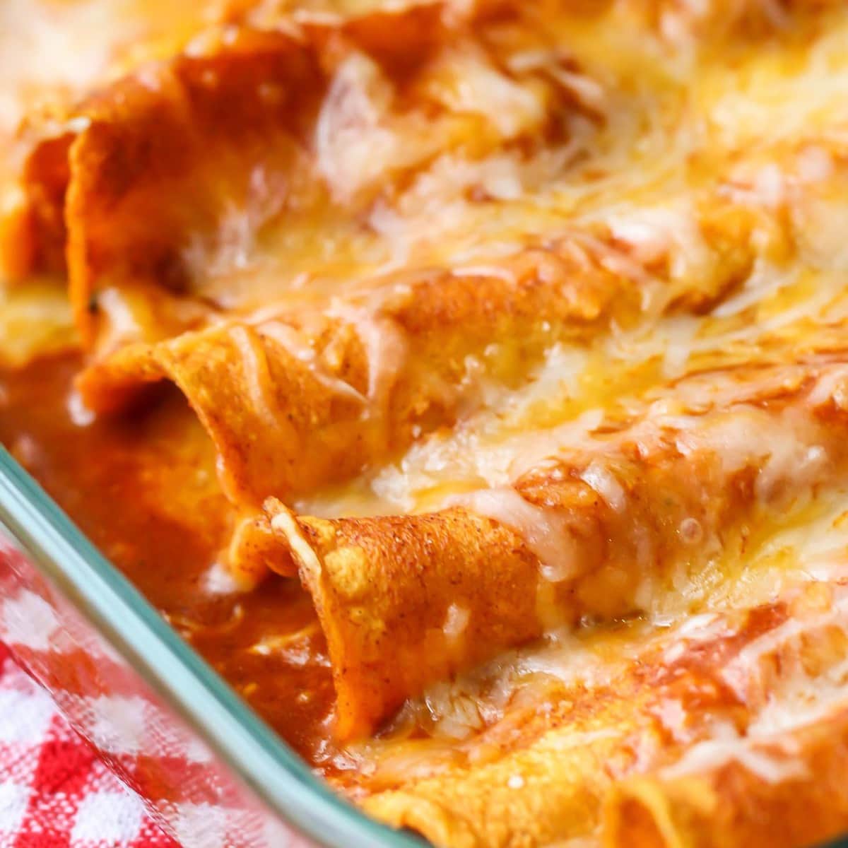Mexican Christmas food - close up of a baking dish filled with cheese enchiladas.