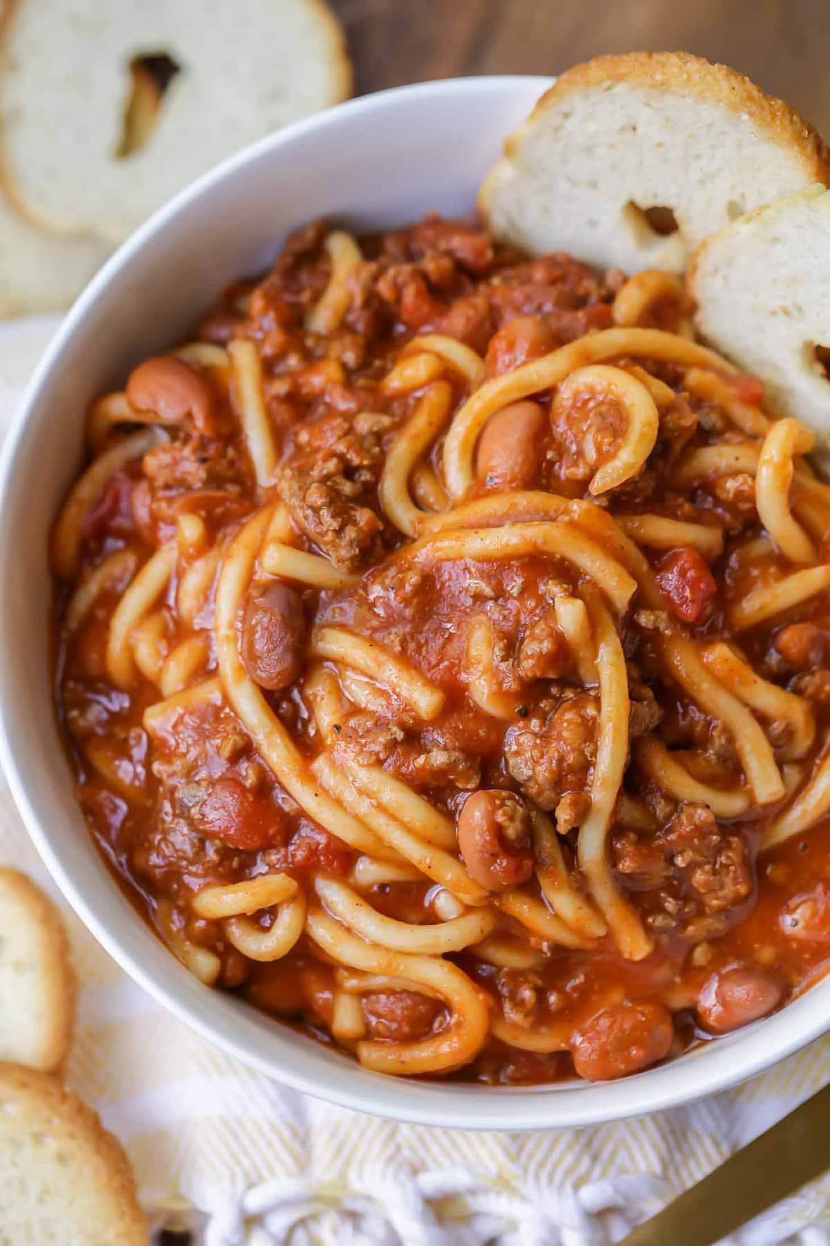 Chili Spaghetti Recipe served with bread slices.