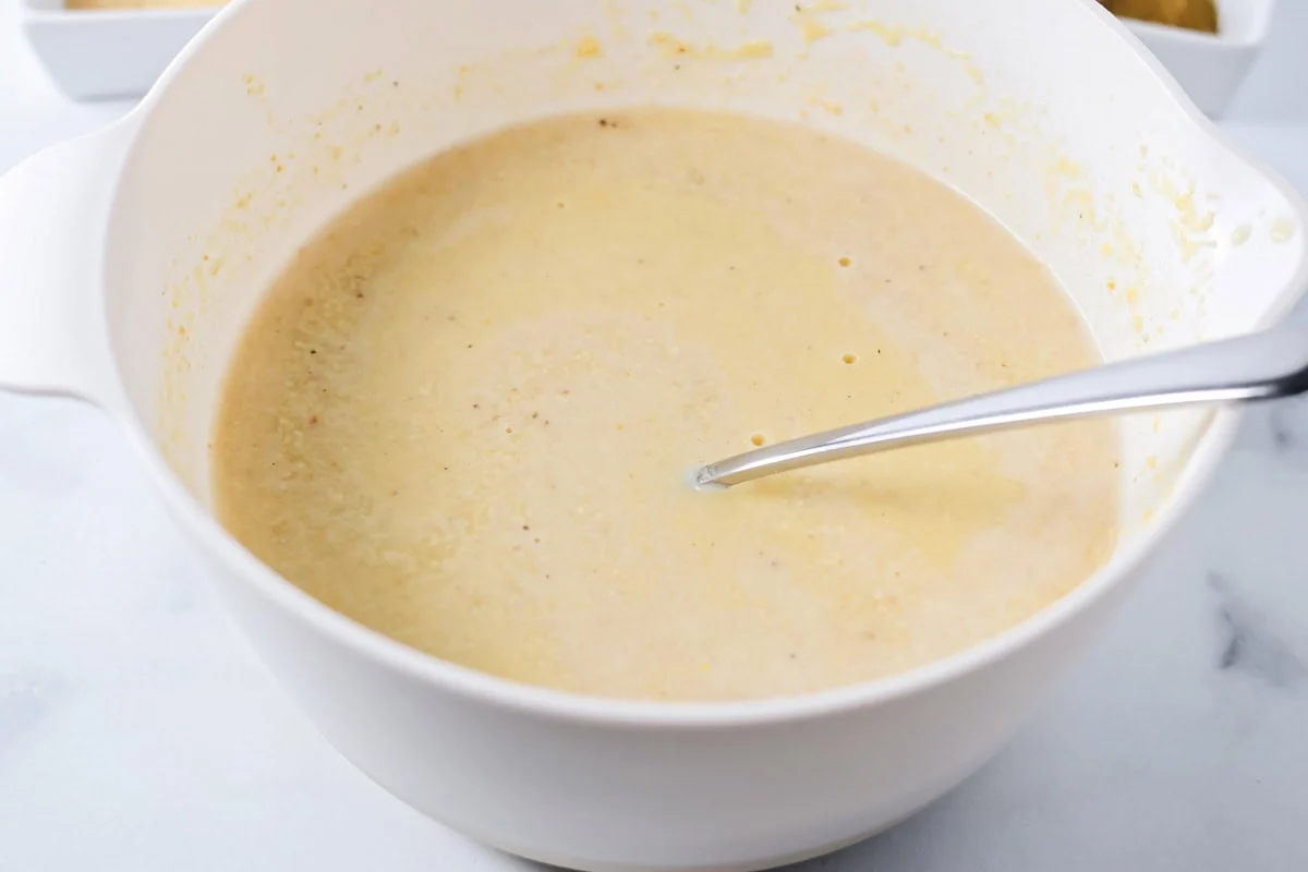 Masa harina mixed together with water in a bowl