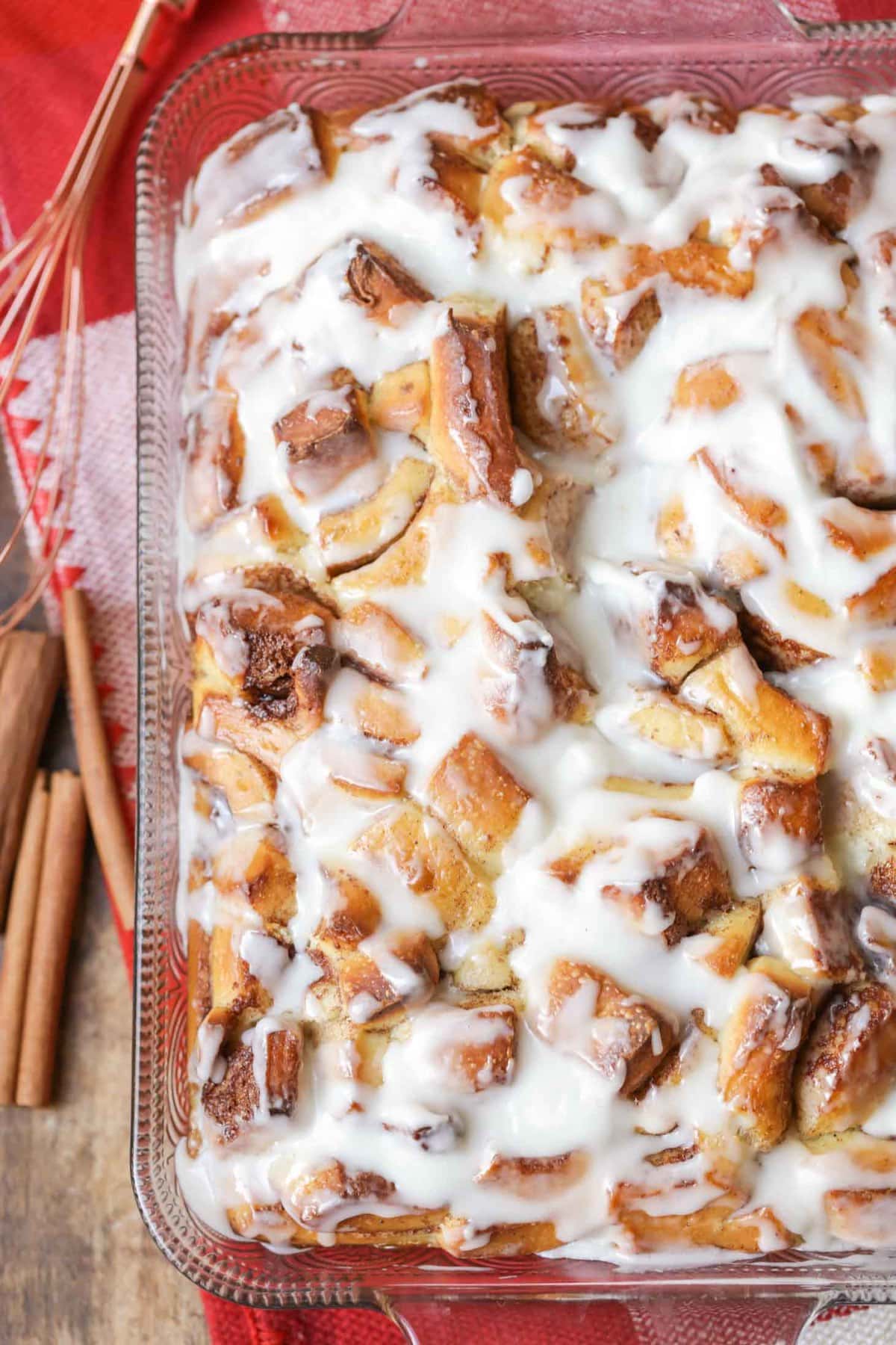 Cinnamon roll casserole covered in icing.