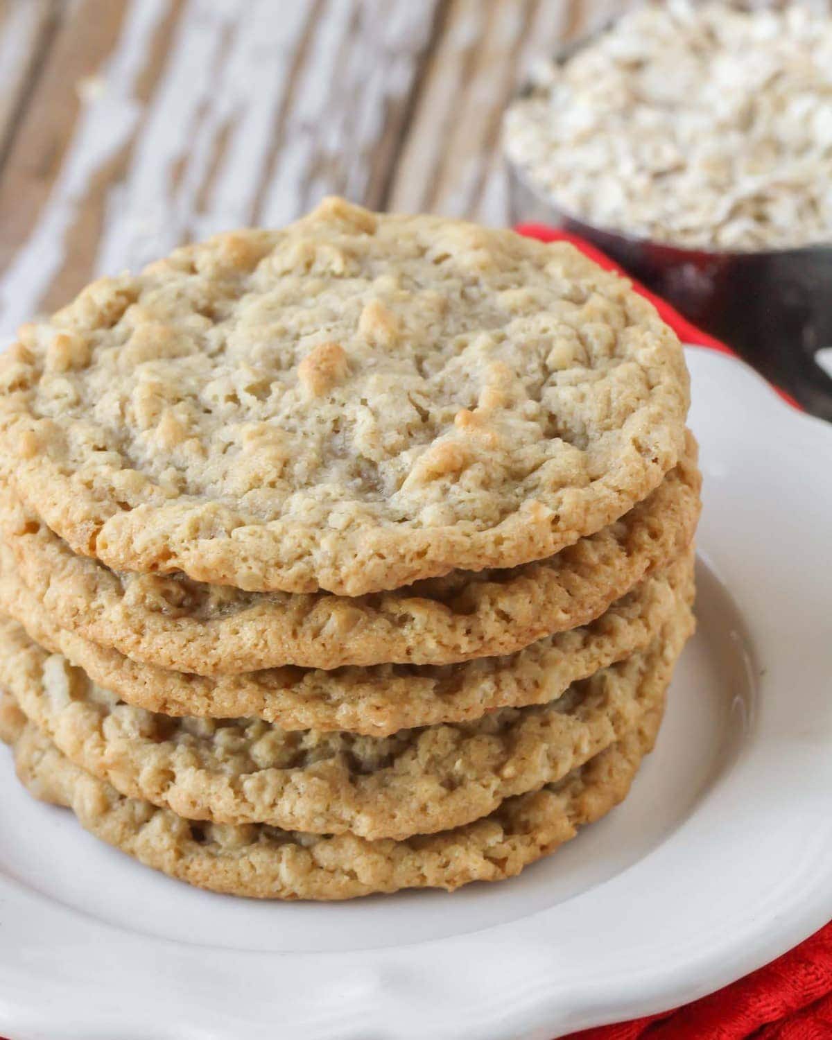 Stack of homemade Oatmeal Coconut Cookies on a white plate