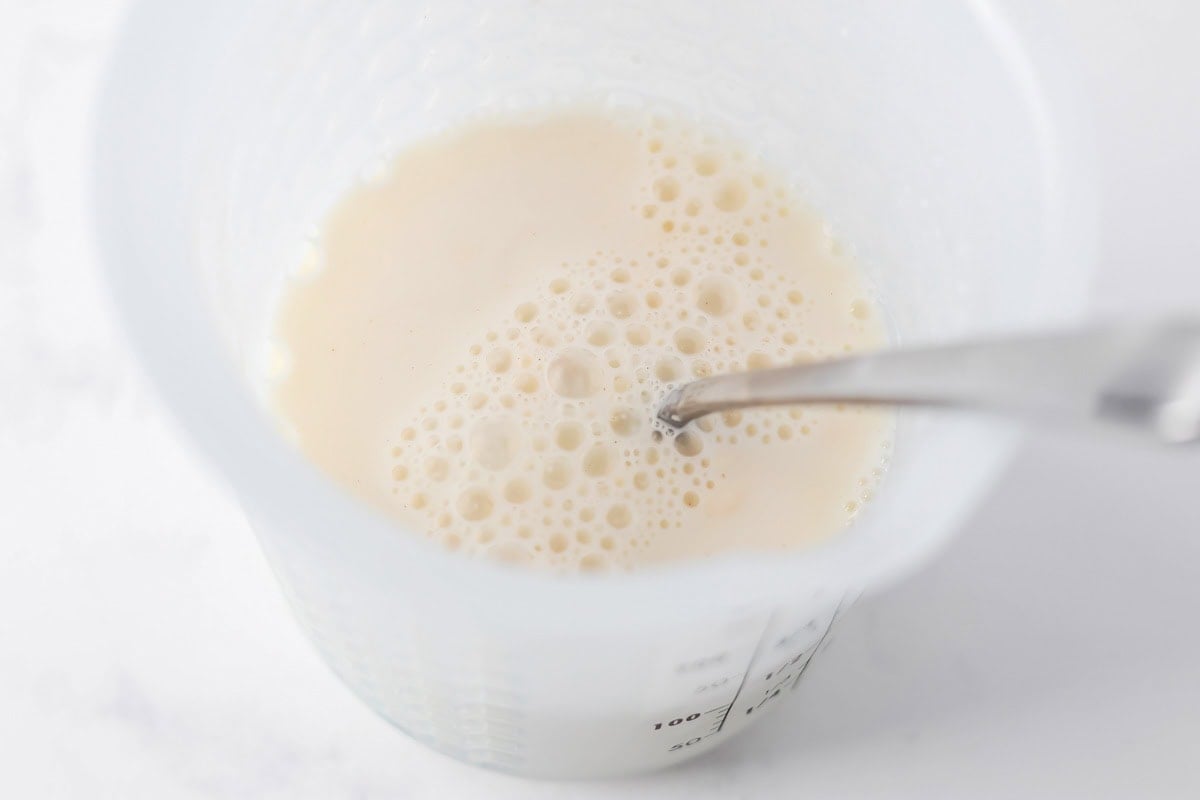 Cream mixture in measuring cup.