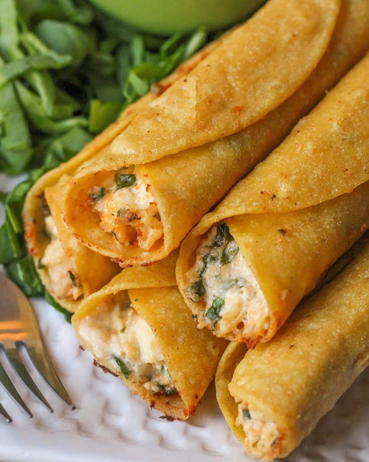 Cream Cheese Chicken Taquitos Recipe stacked on plate