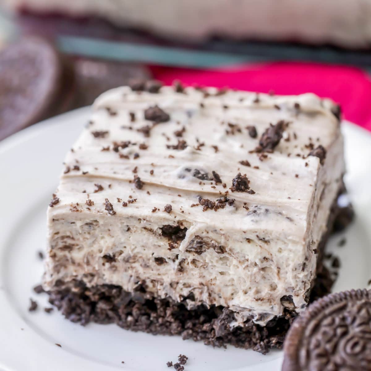 Father's Day Recipes - A slice of no bake oreo cheesecake on a white plate.