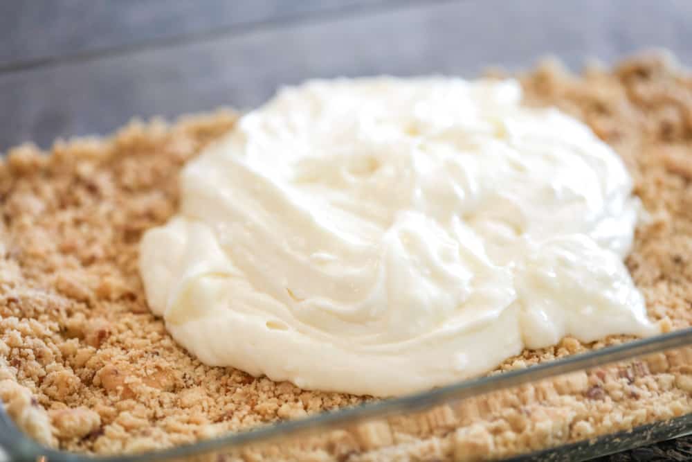 Crushed shortbread crust with a cream cheese layer.