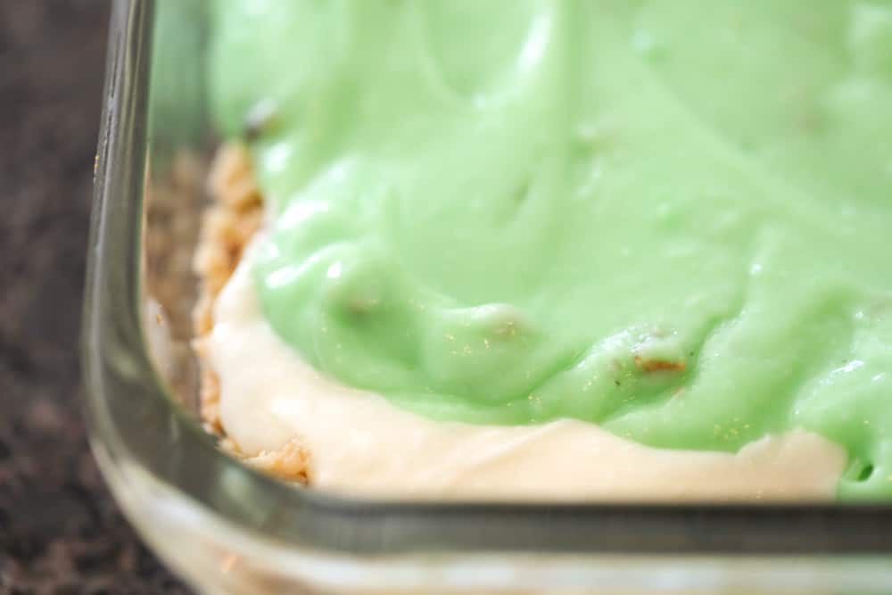 Pistachio pudding layered in a baking dish.