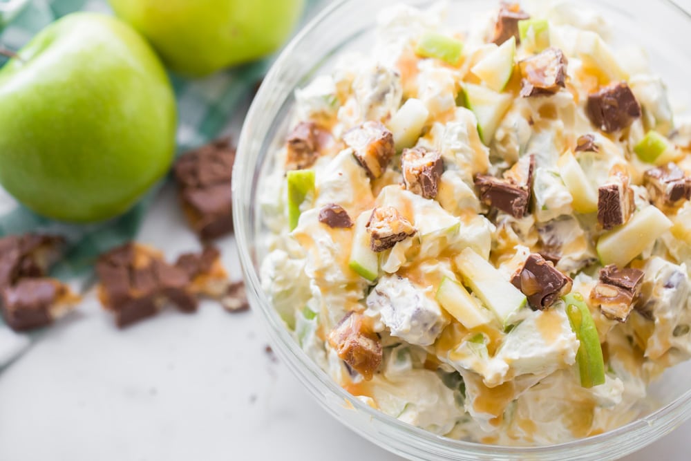 4th of July Side Dishes - Apple Snickers Salad in a glass serving bowl. 