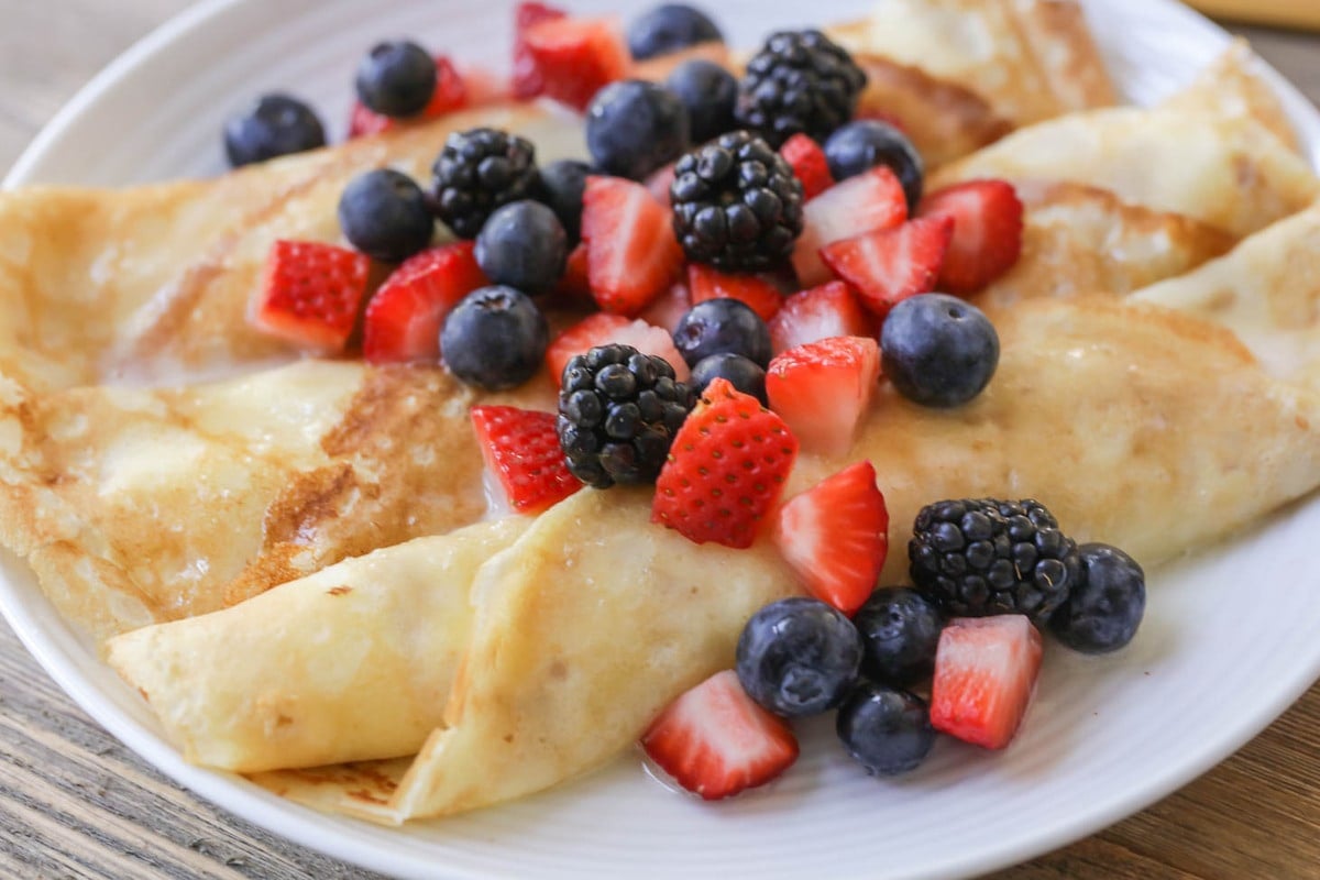 Breakfast for dinner - rolled swedish pancakes topped with fresh berries.