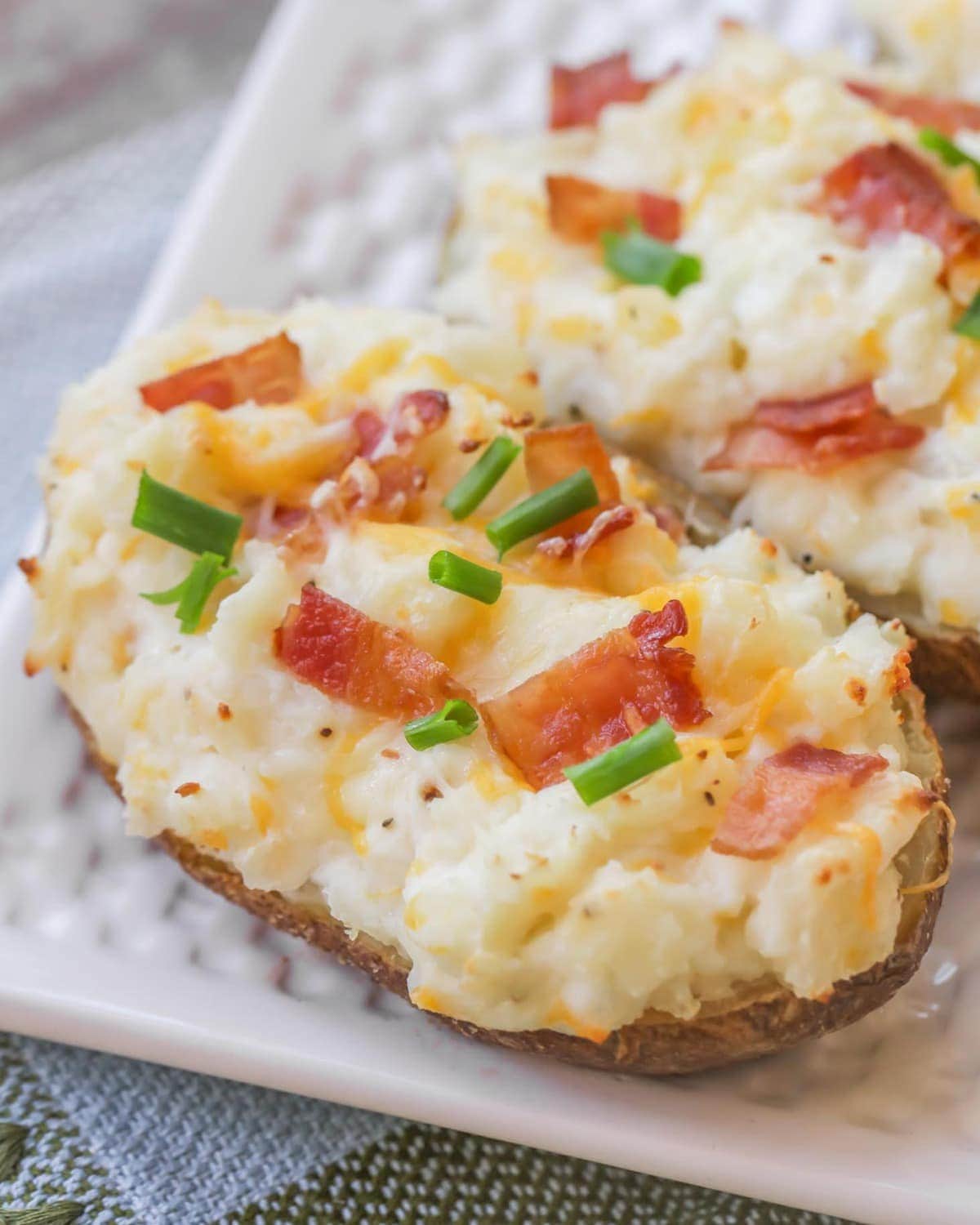 Christmas dinner ideas - close up of two easy twice baked potatoes on a plate.