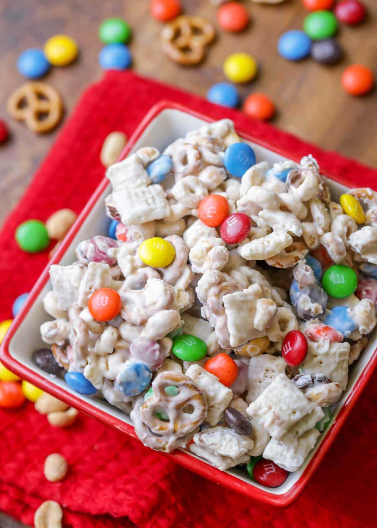 White chocolate chex mix in a red bowl