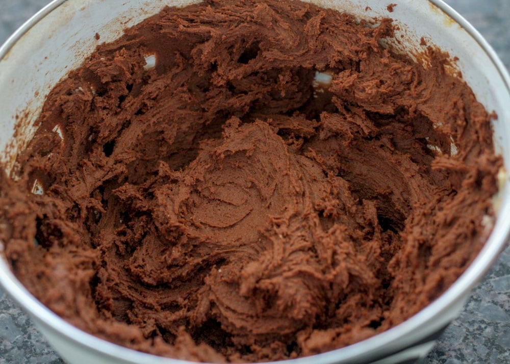 Chocolate turtle cookie dough in a mixing bowl