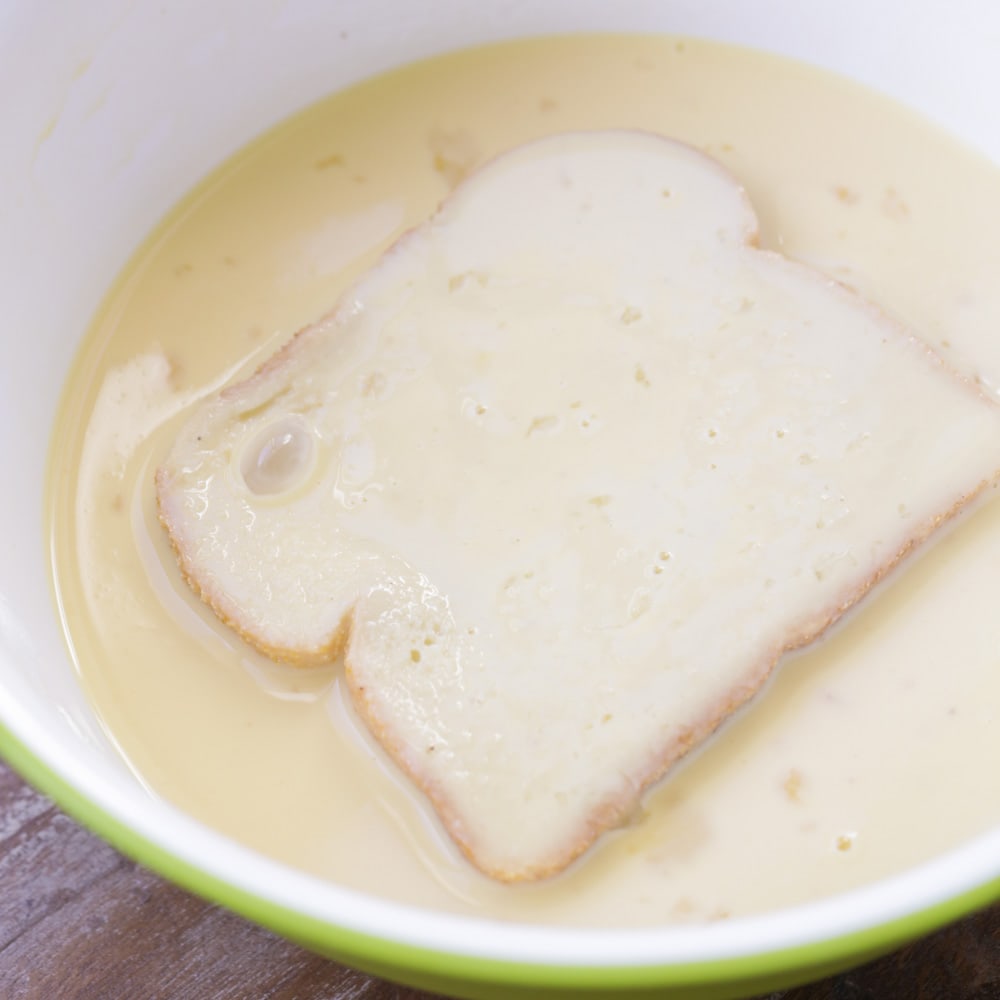How to make french toast with eggnog - dipping bread in egg mixture