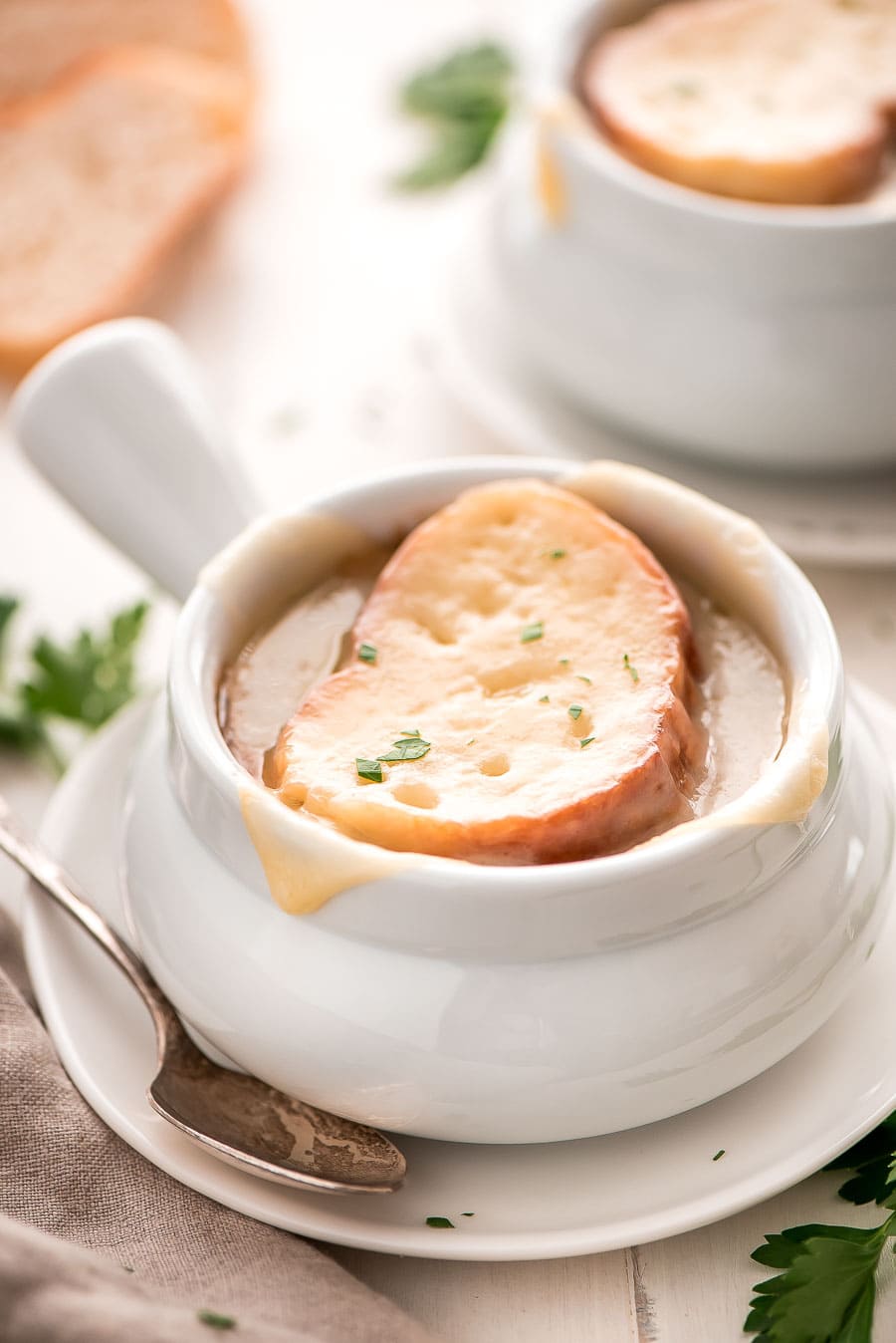 Homemade French Onion Soup topped with cheesy bread