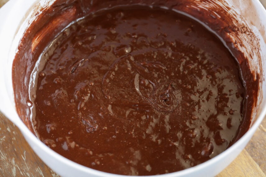 Dense, chewy, and topped with chopped chocolate, these fudgy brownies are every chocolate lover's dream! Brownie batter for fudgy brownie recipe in a mixing bowl