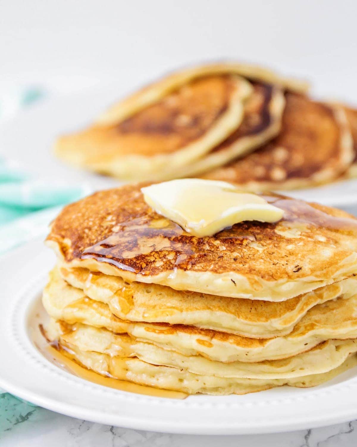 stack of Oatmeal Pancakes on white plate