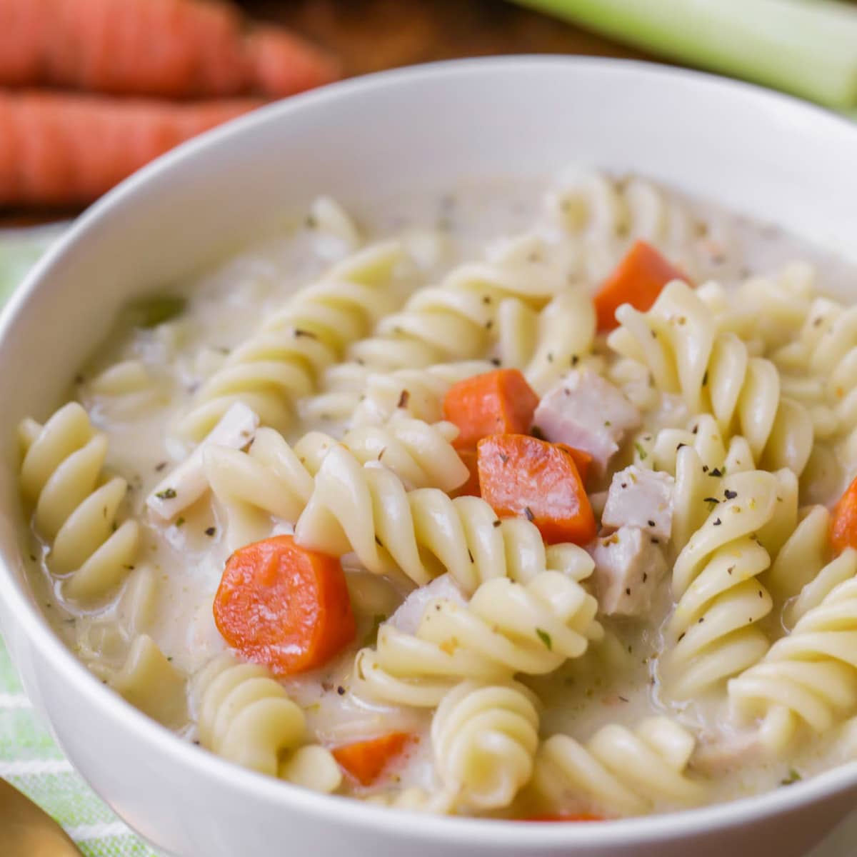 Easy soup recipes - Turkey noodle soup served in a white bowl.