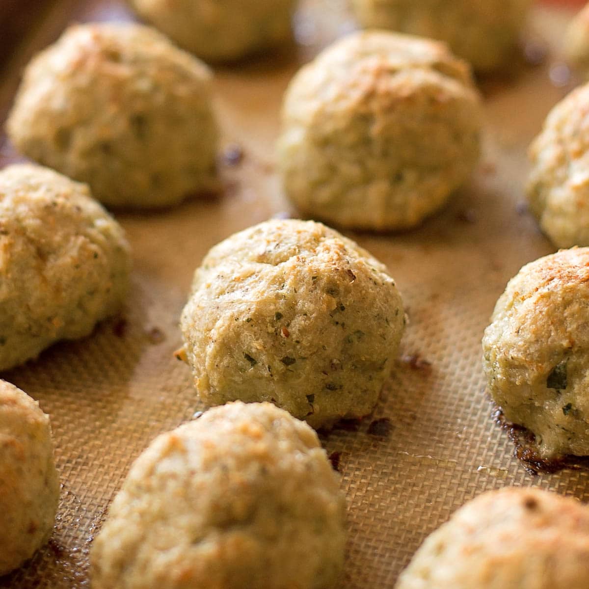 Chicken meatballs on a baking sheet