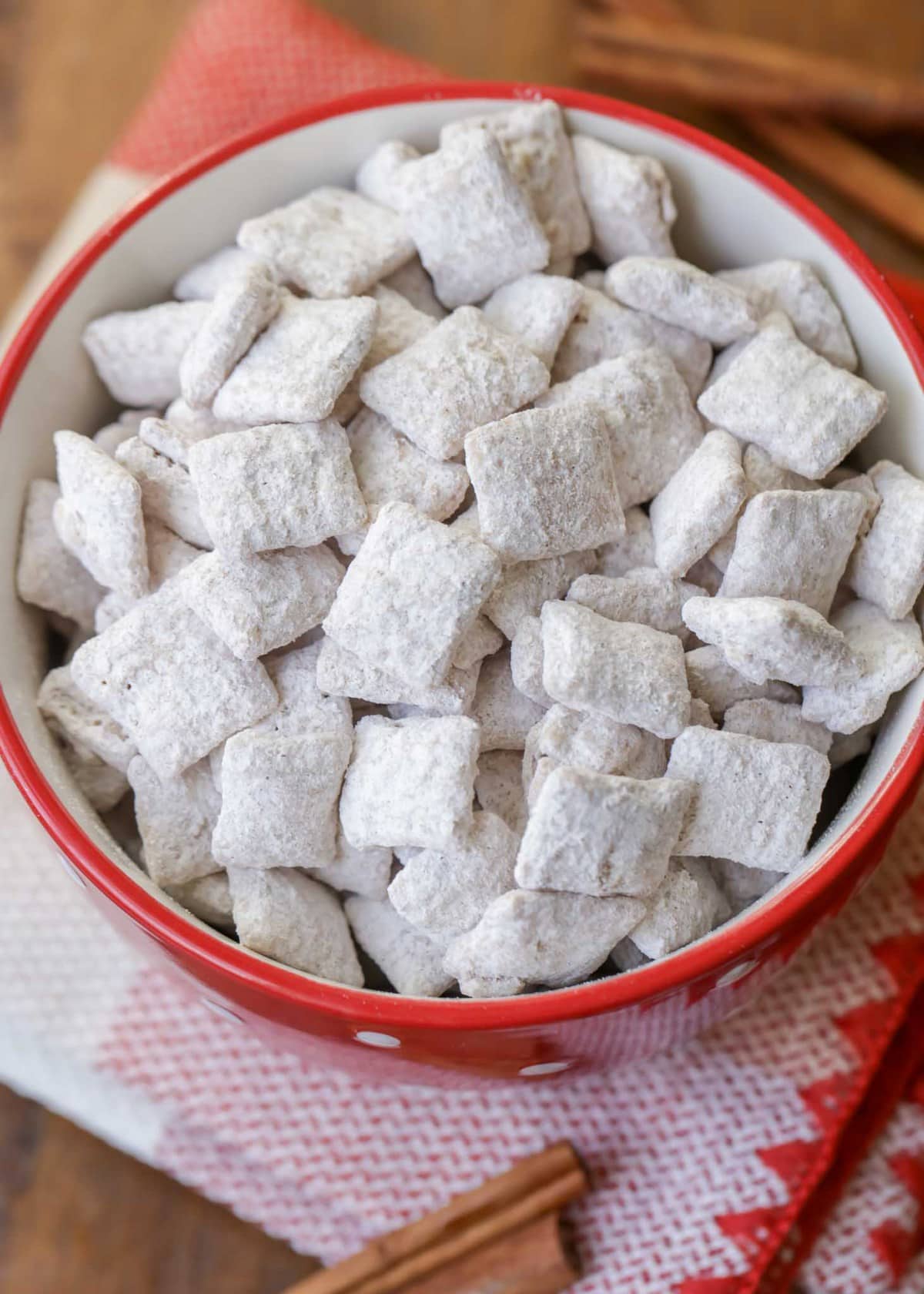 Snickerdoodle puppy chow in a red bowl