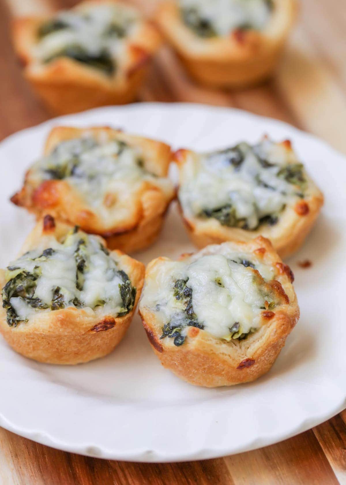 Cheesy Spinach Dip Bites on a white plate