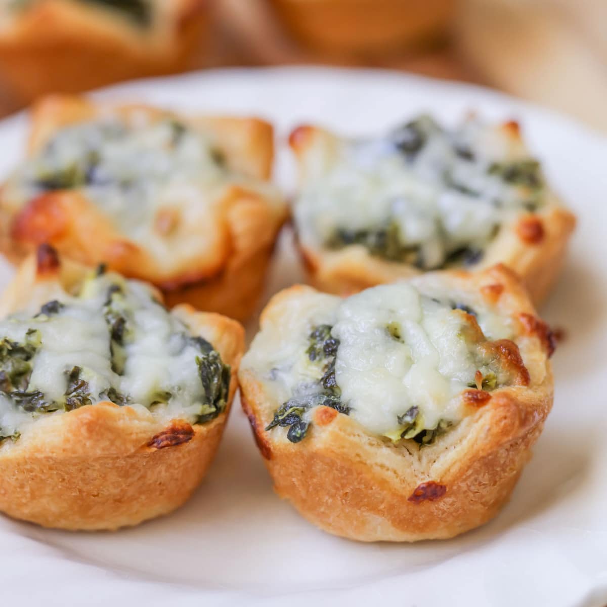 4th of July Appetizers - Spinach dip bites on a white plate.