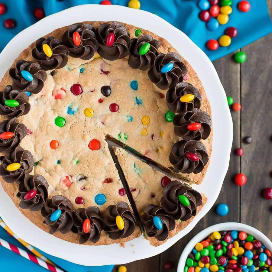 M&M Cookie Cake with a slice cut out