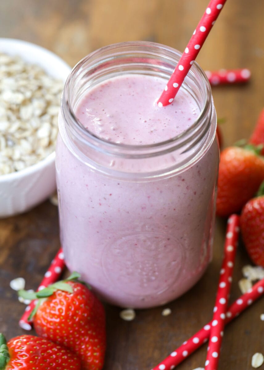 Mason jar filled with strawberry oatmeal smoothie