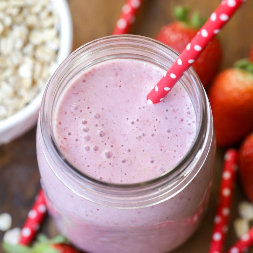 Mug filled with fresh strawberry oatmeal smoothie