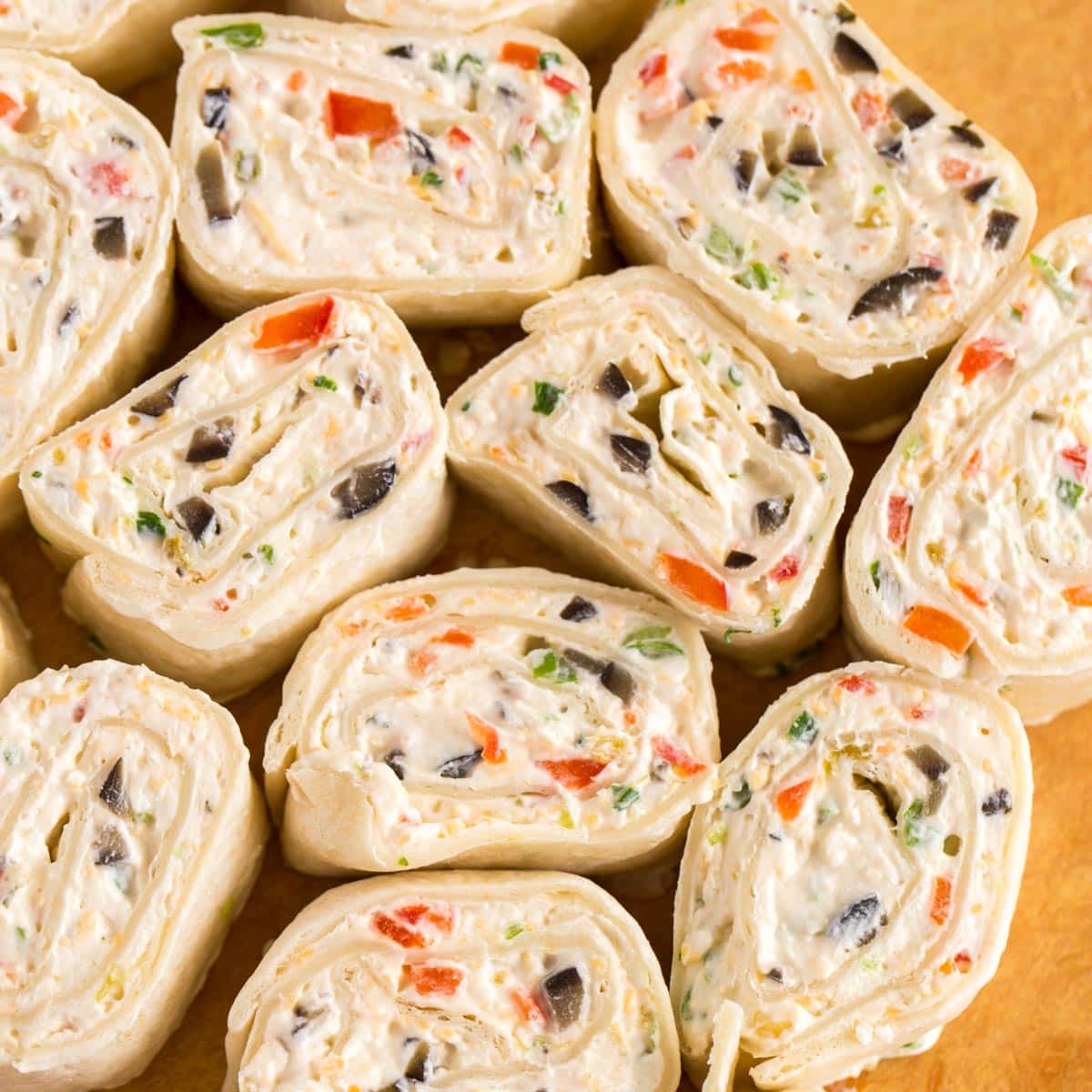 Christmas appetizers -  close up of sliced veggie tortilla roll ups on a plate.
