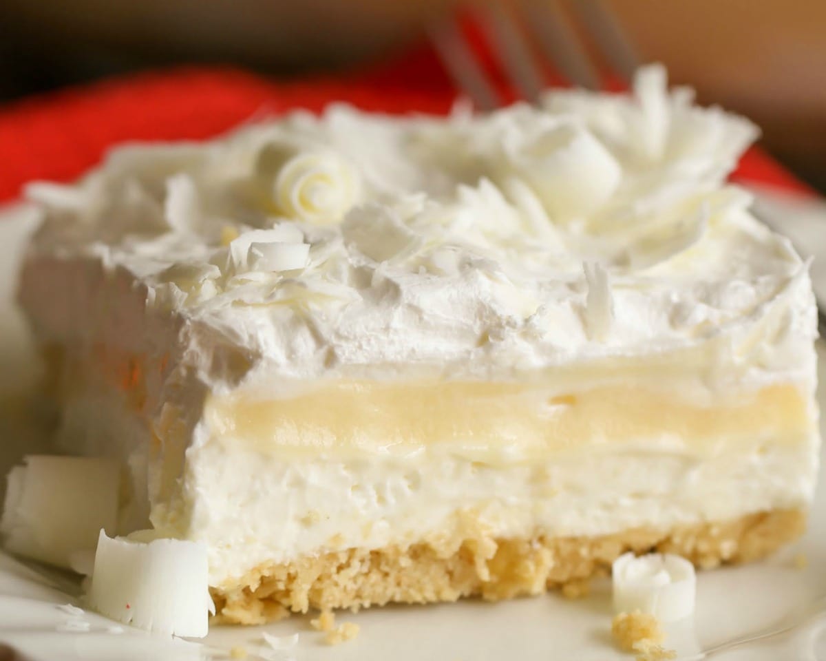 New years eve desserts - close up of a square of white chocolate lasagna topped with white chocolate shavings.