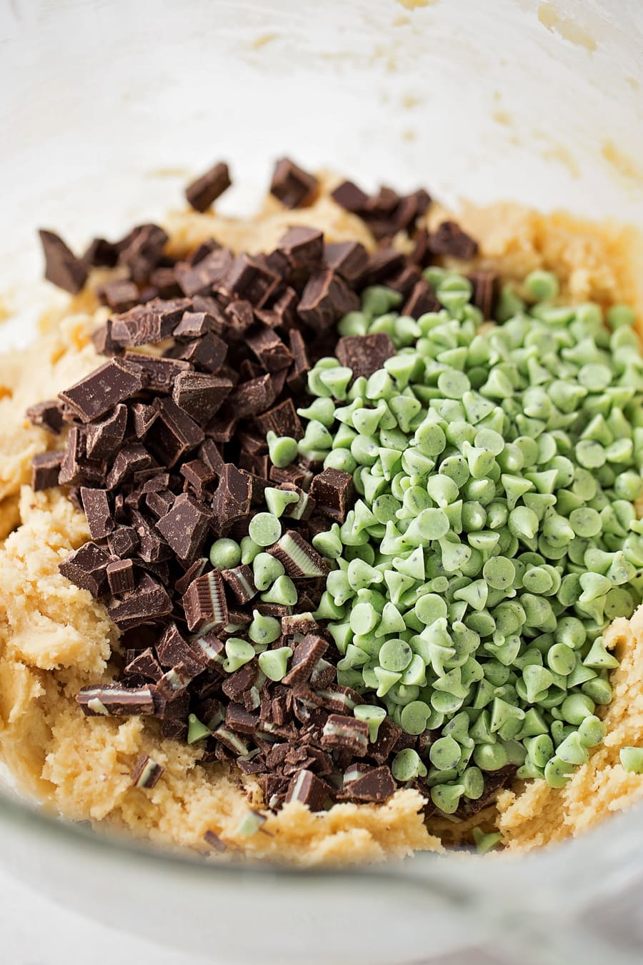 cookie batter covered in Andes mint pieces and mini mint chips