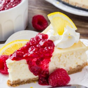 This lemon cheesecake is smooth and creamy with a crunchy graham cracker crust and delicious lemon flavor. Then it's topped with raspberry sauce for the perfect flavor combo. 