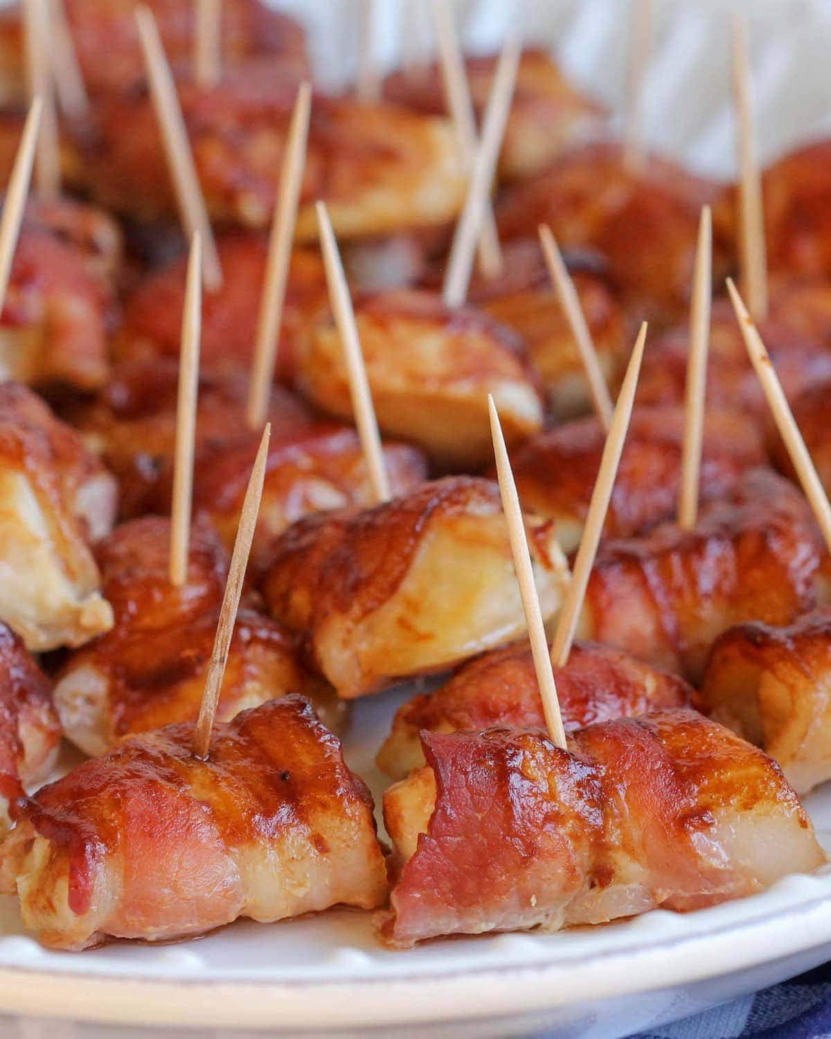 Closeup of Bacon Wrapped Chicken Bites with toothpicks securing them