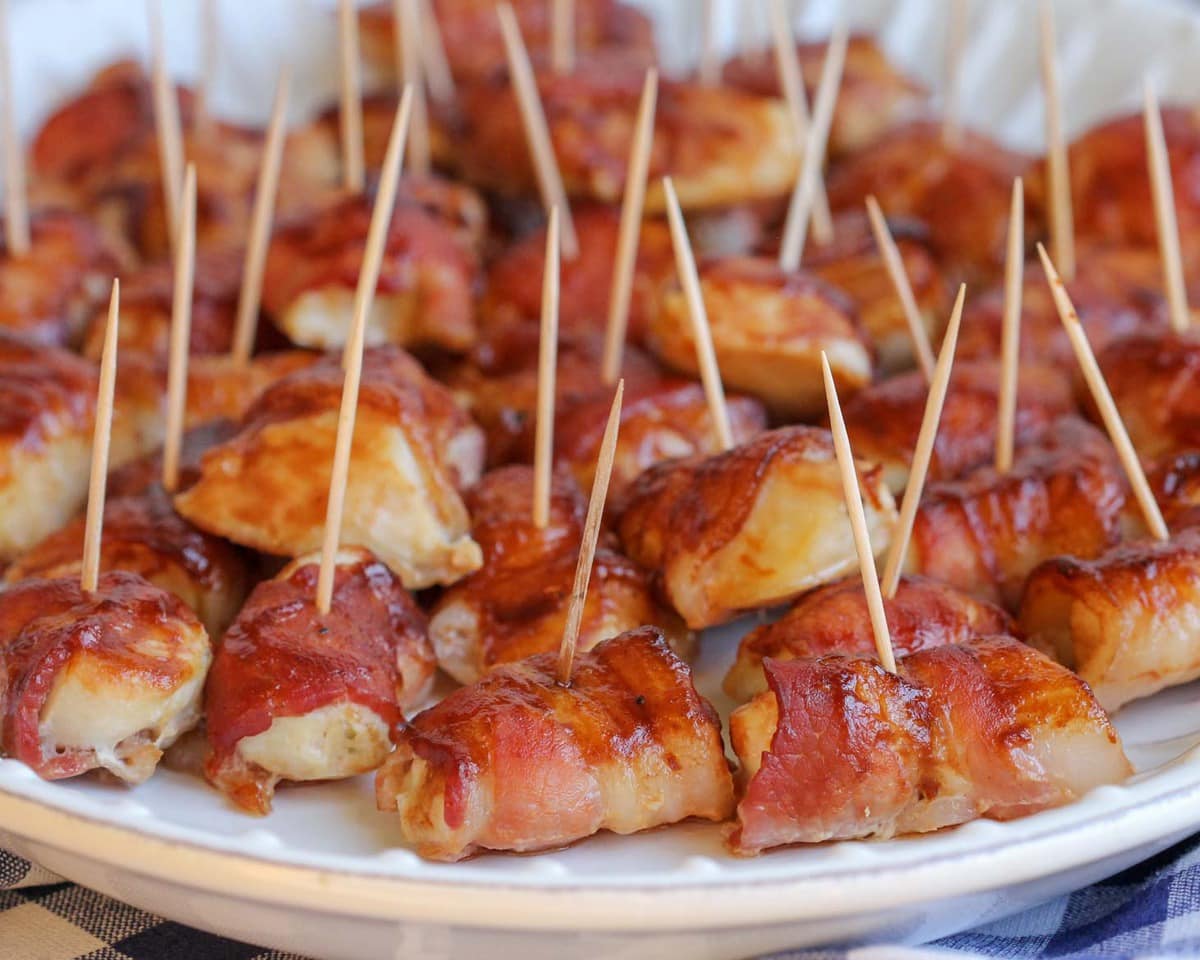 BBQ bacon wrapped chicken bites on a serving platter