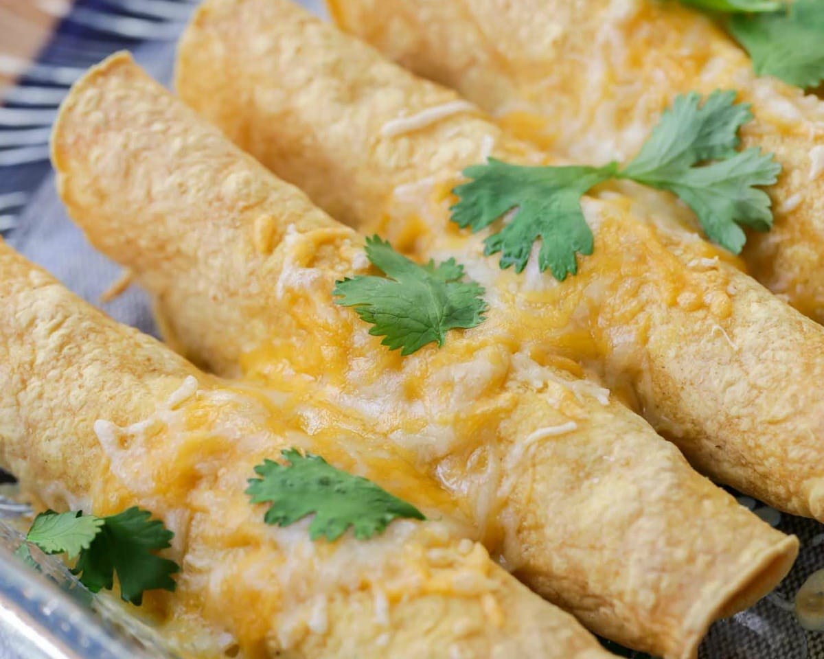 Healthy Appetizers - Baked taquitos topped with melted cheese and cilantro leaves. 