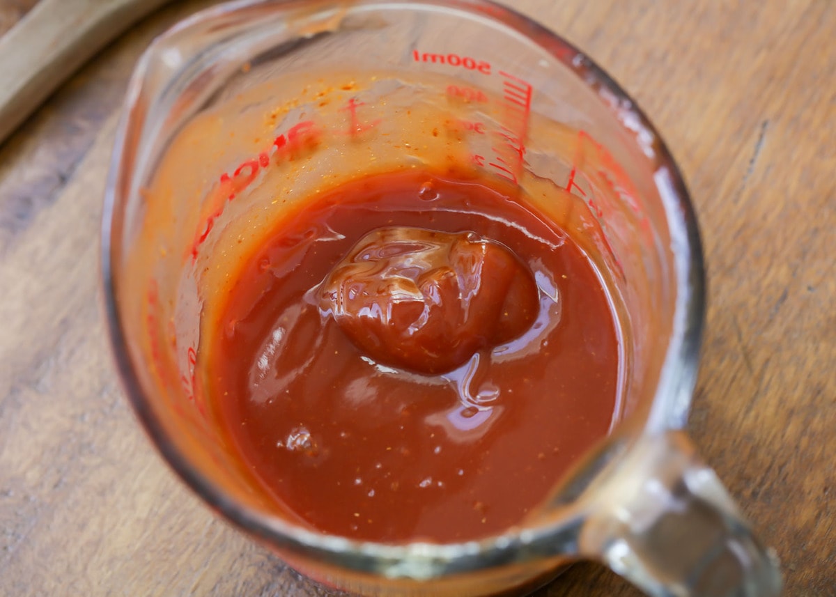 Homemade BBQ Sauce in a glass measuring cup